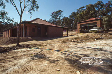 Photograph, House and garage taken from Lot 84, April 1980