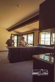 Photograph, Peter and Carla Vermey in dining room from kitchen, April 1980