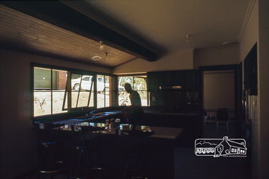 Photograph, Peter Vermey in kitchen from family room, April 1980
