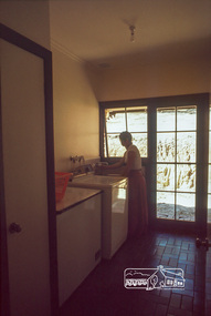 Photograph, Carla Vermey in laundry, April 1980