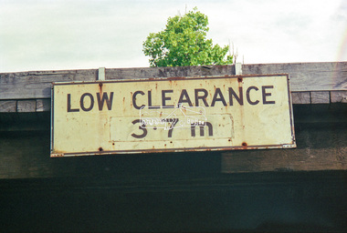 Negative - Photograph, "Low Clearance" sign, Eltham Trestle Bridge, 1998c