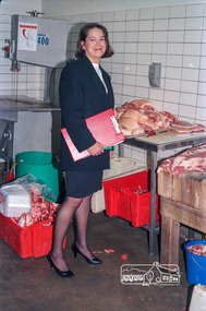 Photograph, Dianne Yans, Health Inspector, undertaking inspections at Safeway Supermarket, 1989