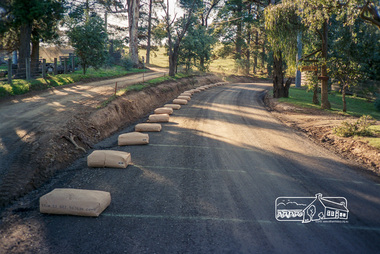 Photograph, Roadworks prior to sealing along Mount Pleasant Road near the junction with Reynolds Road, Eltham, c.1988, 1988c