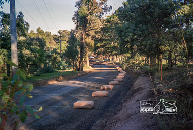 Photograph, Roadworks prior to sealing along Mount Pleasant Road near the junction with Reynolds Road, Eltham, c.1988, 1988c