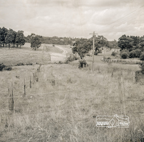 Photograph, Looking east from the northern side of Lower Plenty Road (opposite Bannockburn Road) as it crosses the Watsonia Drain, Viewbank, c.1965, 1965c