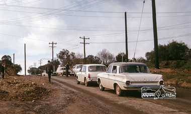 Photograph, Fred Mitchell, Traffic delays at the corner of Bridge Street and Main Road, Eltham, during duplication works, 1968, 1968