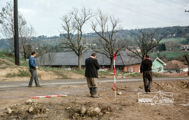 Photograph, Fred Mitchell, Surveyors laying out the new corner of Bridge Street and Main Road, Eltham, during duplication works, 1968