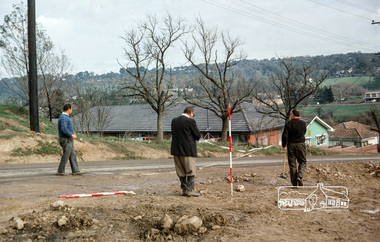 Photograph, Fred Mitchell, Surveyors laying out the new corner of Bridge Street and Main Road, Eltham, during duplication works, 1968, 1968