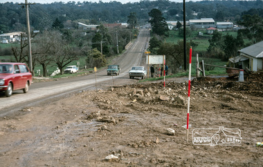 Photograph, Fred Mitchell, Surveyors laying out the new corner of Bridge Street and Main Road, Eltham, during duplication works, 1968, 1968