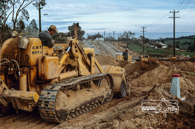 Photograph, Fred Mitchell, Road construction during duplication of Main Road near Our Lady Help of Christians Church, Henry Street, Eltham, 1968