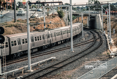 Photograph, Fred Mitchell, Hitachi Train proceeding under the Main Street bridge, Greensborough, 1983, 1983