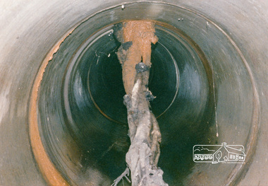 Photograph, Tree roots in main stormwater drain, Eltham Shire Council maintenance works, Lower Plenty, c.1989, 1989c