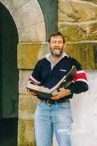 Photograph, Russell Yeoman reading from his notes at the tower entrance, forecourt apron of War Memorial Tower, Heritage Excursion, 22 October 1996, 22/10/1996