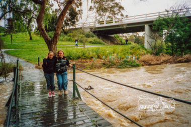 Photograph, Diamond Creek in flood, Bridge Street footbridge, Sunday, 7 November 2004, 07/11/2004