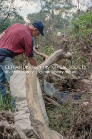 Negative - Photograph, Cleaning up debris following flooding of the Diamond Creek in Eltham, Nov-Dec 2004, February 2005