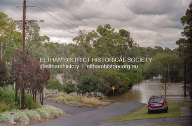 Photograph, Diamond Creek floodwaters, Brougham St Bridge submerged, Eltham, February 2005