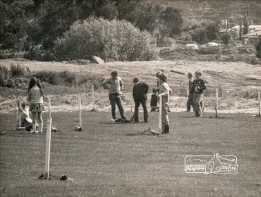 Photograph, ELTHAM ARBOR DAY 1973 - Alistair Knox with school children of the Shire of Eltham, Vic, planting native trees in the Town Park, 10 October 1973, 1973-10-10