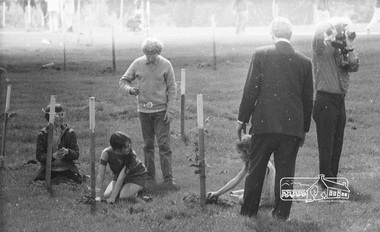 Photograph, ELTHAM ARBOR DAY 1973 - Alistair Knox with school children of the Shire of Eltham, Vic, planting native trees in the Town Park, 10 October 1973, 1973-10-10