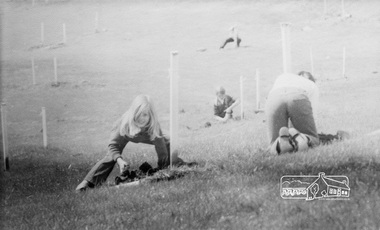 Photograph, ELTHAM ARBOR DAY 1973 - Alistair Knox with school children of the Shire of Eltham, Vic, planting native trees in the Town Park, 10 October 1973, 1973-10-10