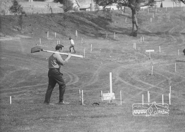 Photograph, ELTHAM ARBOR DAY 1973 - Alistair Knox with school children of the Shire of Eltham, Vic, planting native trees in the Town Park, 10 October 1973, 1973-10-10