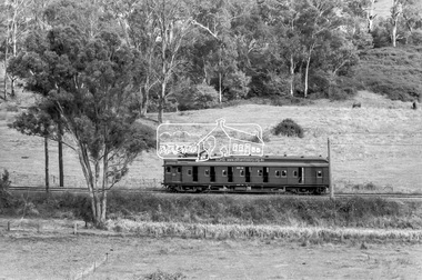 Photograph, George Coop, Eltham bound Single Motor Carriage 471M Tait (Red Rattler) train from Hurstbridge approaches the level crossing at Allendale Road, Eltham, March 1980, 1980