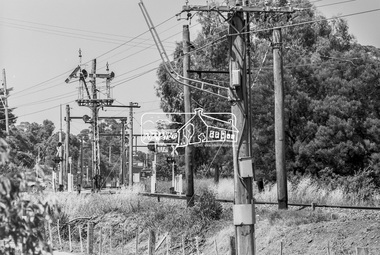Photograph, George Coop, Looking south across the level crossing at Diamond Street towards Eltham Railway Station, c. December 1980, 1980