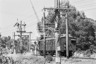 Photograph, George Coop, Single Motor Carriage 471M Tait (Red Rattler) train from Hurstbridge crossing Diamond Street as it  approaches Eltham Station, c. December 1980, 1980