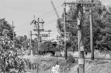 Photograph, George Coop, Single Motor Carriage 471M Tait (Red Rattler) train from Hurstbridge crossing Diamond Street as it  approaches Eltham Station, c. December 1980, 1980