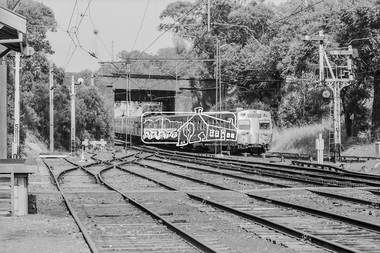 Photograph, George Coop, A Hurstbridge bound Hitachi train passes under the Banksia Street overpass as it approaches Heidelberg Railway Station, c.1980, 1980