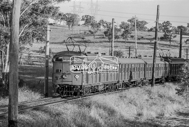 Photograph, George Coop, A Hurstbridge bound Tait (Red Rattler) train just passes through the level crossing at Allendale Road, Eltham, c.1981, 1981