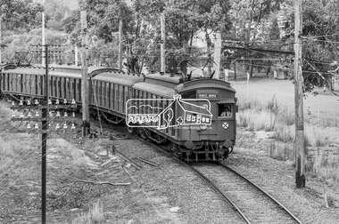 Photograph, George Coop, A Princes Bridge bound Tait (Red Rattler) train approaching the Eltham Railway Trestle Bridge, 7-8 February 1981, 1981