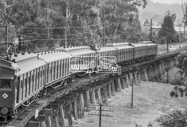 Photograph, George Coop, A Princes Bridge bound Tait (Red Rattler) train crossing the Eltham Railway Trestle Bridge, 7-8 February 1981, 1981