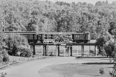 Photograph, George Coop, A Tait (Red Rattler ) train crosses the Eltham Railway Trestle Bridge at Panther Place, Eltham, 7-8 February 1981, 1981