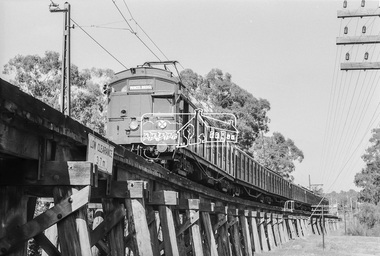Photograph, George Coop, A Tait (Red Rattler) train crossing the Eltham Railway Trestle Bridge approaching Eltham Station, 7-8 February 1981, 1981