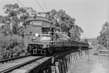 Photograph, George Coop, A Princes Bridge bound Tait (Red Rattler) train crossing the Eltham Railway Trestle Bridge, 7-8 February 1981, 1981