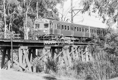 Photograph, George Coop, Flinders Street bound Hitachi train crossing the Eltham Railway Trestle Bridge, 21 August 1983, 1983