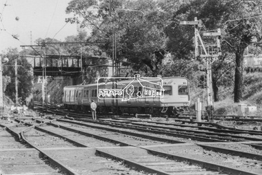 Photograph, George Coop, An Eltham bound Hitachi train passes under the Banksia Street overpass as it approaches Heidelberg Railway Station, 23 August 1983, 1983