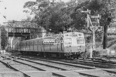 Photograph, George Coop, A Flinders Street bound Hitachi train passes under the Banksia Street overpass as it departs Heidelberg Railway Station, 23 August 1983, 1983