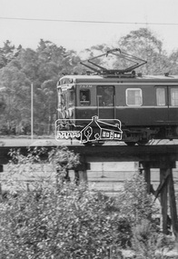 Photograph, George Coop, A Harris (Blue) train bound for Princes Bridge crossing the Eltham Railway Trestle Bridge at Panther Place, c.1980, 1980