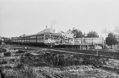 Photograph, George Coop, Victorian Railways locomotive 454 with passenger train bound for Essendon, 1962