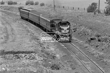 Photograph, George Coop, T-class Diesel Electric locomotive T-406 with three carriages heading for Ballarat near Ballan, c.October 1982, 1982