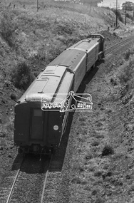 Photograph, George Coop, T-class Diesel Electric locomotive T-406 with three carriages heading for Ballarat near Ballan, c.October 1982, 1982