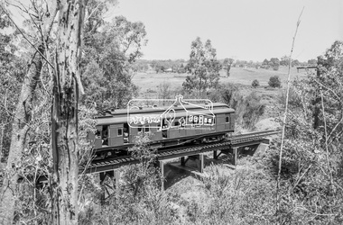 Photograph, George Coop, Single Motor Carriage 471M (Red Rattler) Tait train crossing over the Diamond Creek just north of Allendale Road, c.December 1980, 1980