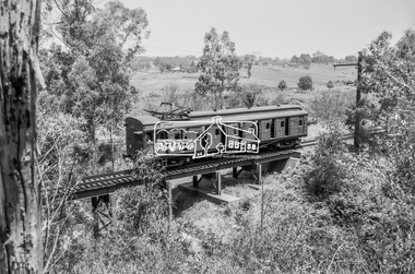 Photograph, George Coop, Single Motor Carriage 471M (Red Rattler) Tait train heading for Eltham crossing over the Diamond Creek just north of Allendale Road, c.December 1980, 1980