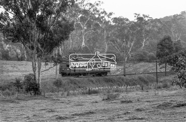 Photograph, George Coop, Single Motor Carriage 473M (Red Rattler) Tait train heading from Eltham to Hurstbridge, possibly near Eltham North, 3 July 1983, 1983