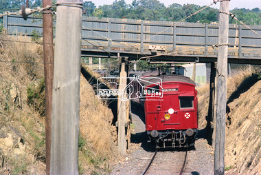 Photograph, George Coop, An Eltham bound Tait (Red Rattler) train passes under the Silver Street railway overpass, Eltham, c. March 1981, c. March 1981