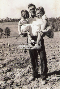 Photograph, Frank Stokes with daughters Dorothy (left) and Beryl (right) at Stokes Orchard, Nyora Road, Eltham, 1944, 1944
