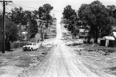 Photograph, Looking west along Bridge Street towards intersection with Bible Street, Eltham, c.September 1966, 1966c
