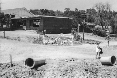 Photograph, Looking southeast towards Eltham Milk Bar at Bible Street and Pitt Street, Eltham, c.September 1966, 1966c