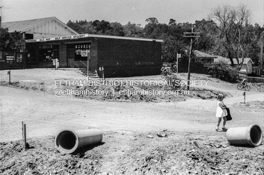 Photograph - Black and White Print, Shire of Eltham, Looking southeast towards Eltham Milk Bar at Bible Street and Pitt Street, Eltham, c. Sep. 1966